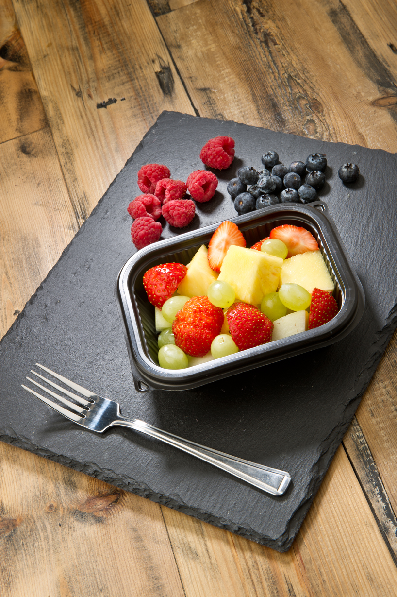 Fruit basket with berries and grapes