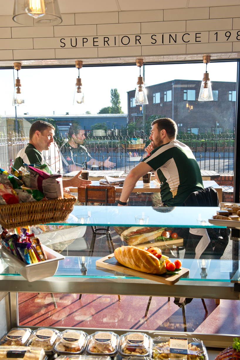 Men having a discussion in the Superior Espresso Bar